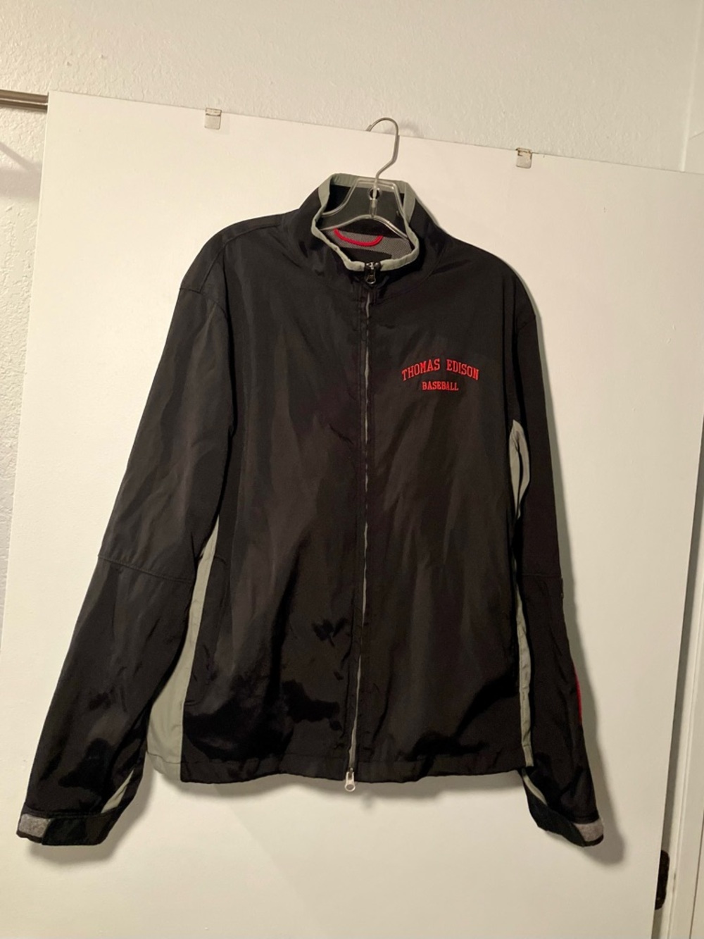 Port Authority Black Windbreaker with Gray Accents and Red Logo